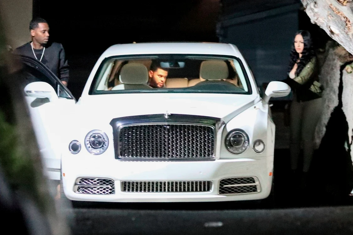 *EXCLUSIVE* Newly single, The Weeknd slips into his ride with a mystery woman at Delilah jpeg