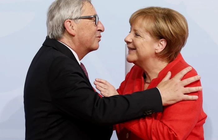 Jean Claude Juncker şi Angela Merkel FOTO EPA