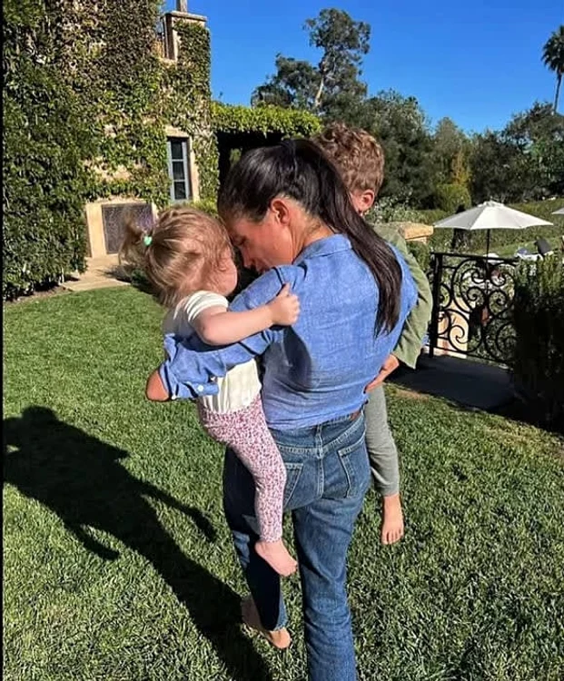 meghan markle carrying archie and lilibet jpg