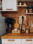 close up modern cozy kitchen white brown colors with stuff cooker decorative fir tree branches christmas decorations jpg