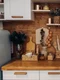 close up modern cozy kitchen white brown colors with stuff cooker decorative fir tree branches christmas decorations jpg