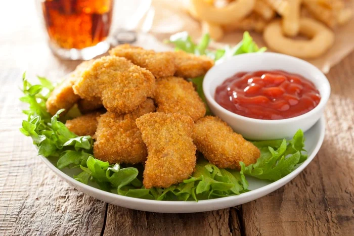 41631904 fast food chicken nuggets with ketchup, french fries, cola jpeg