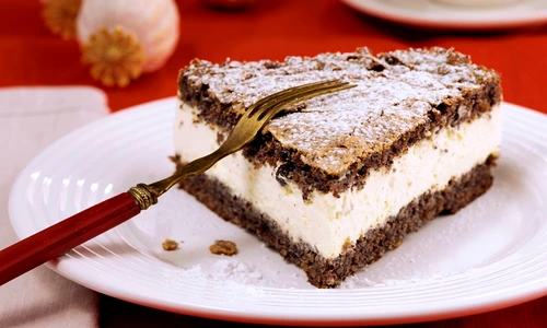 Piece of poppy seed cake with cream filling jpeg