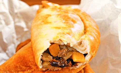 Two whole Cornish pasties & one with a bite taken (England) jpeg