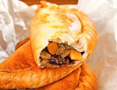 Two whole Cornish pasties & one with a bite taken (England) jpeg