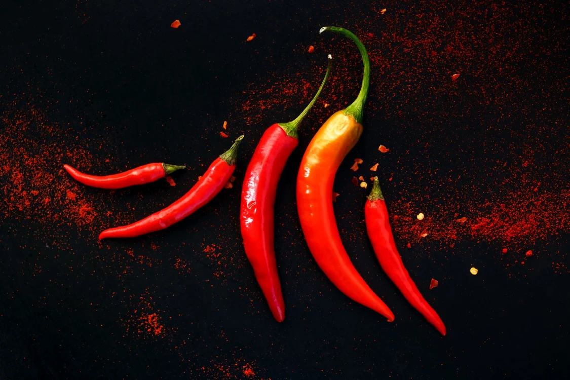 46018788 chili peppers on a black background jpeg