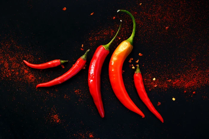 46018788 chili peppers on a black background jpeg