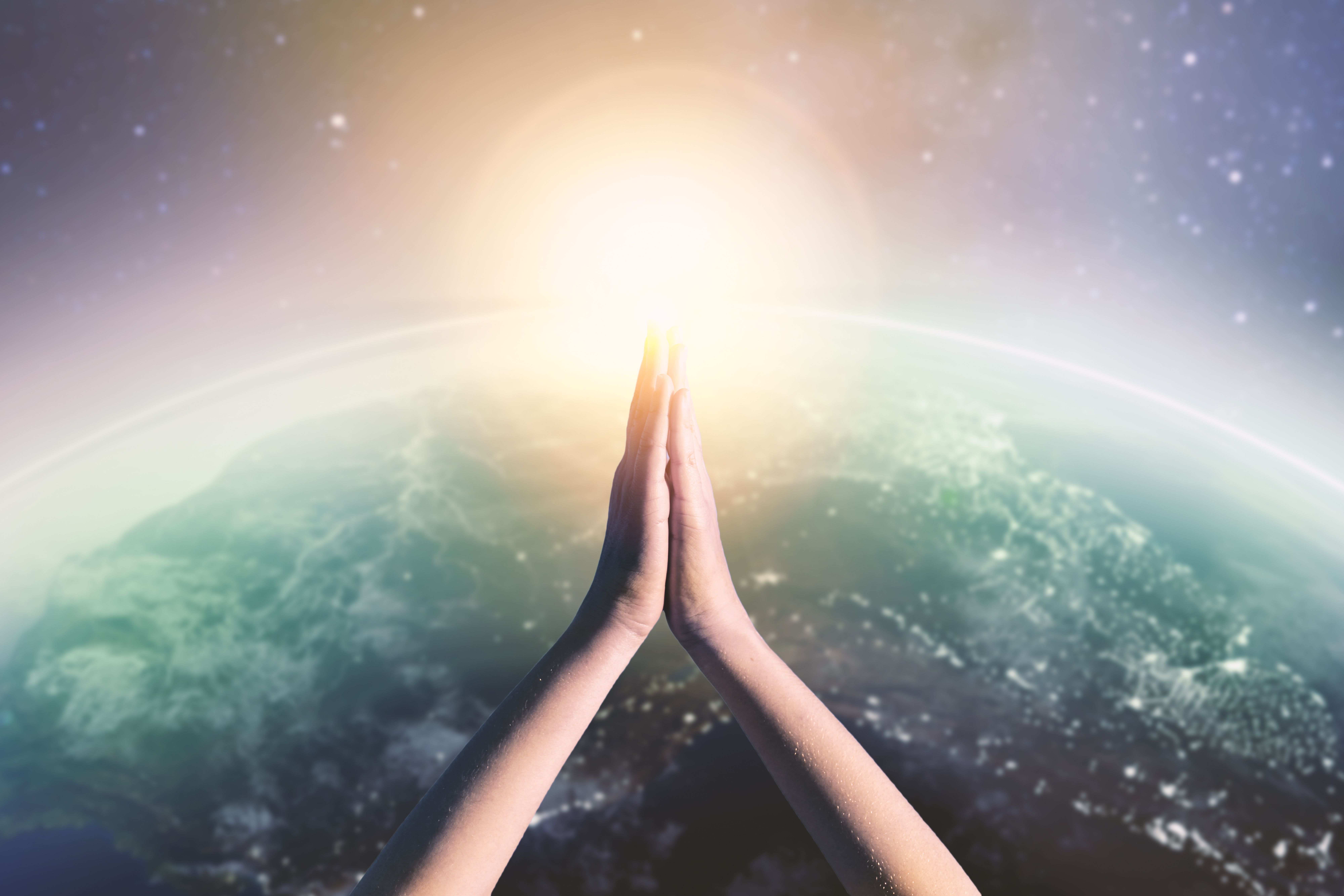 adult meditating with planet view jpg