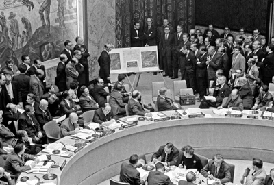 Adlai Stevenson shows missiles to UN Security Council with David Parker standing jpg