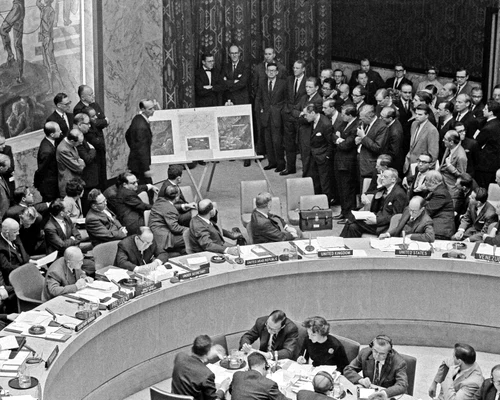 Adlai Stevenson shows missiles to UN Security Council with David Parker standing jpg