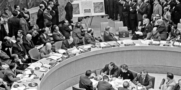 Adlai Stevenson shows missiles to UN Security Council with David Parker standing jpg