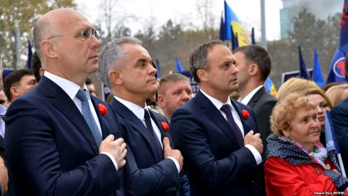 Pavel Filip Vlad Plahotniuc şi Adrian Candu la un miting PDM din Chişinău FOTO RFE-RL/Tatiana Eţco