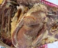 Specialități de Crăciun realizate în urma tăierii porcului la români - carne afumată Sursă Muzeul Astra