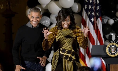 U S  President Obama and first lady Michelle Obama hand out treats during a Halloweenat the White House   DC jpeg