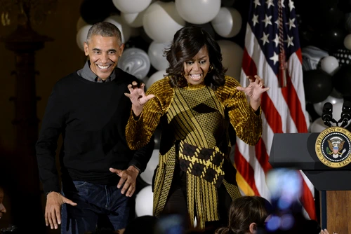 U S President Obama and first lady Michelle Obama hand out treats during a Halloweenat the White House DC jpeg