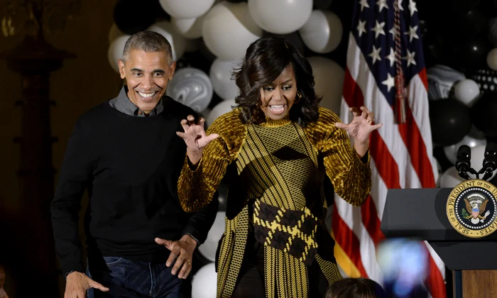 U S  President Obama and first lady Michelle Obama hand out treats during a Halloweenat the White House   DC jpeg