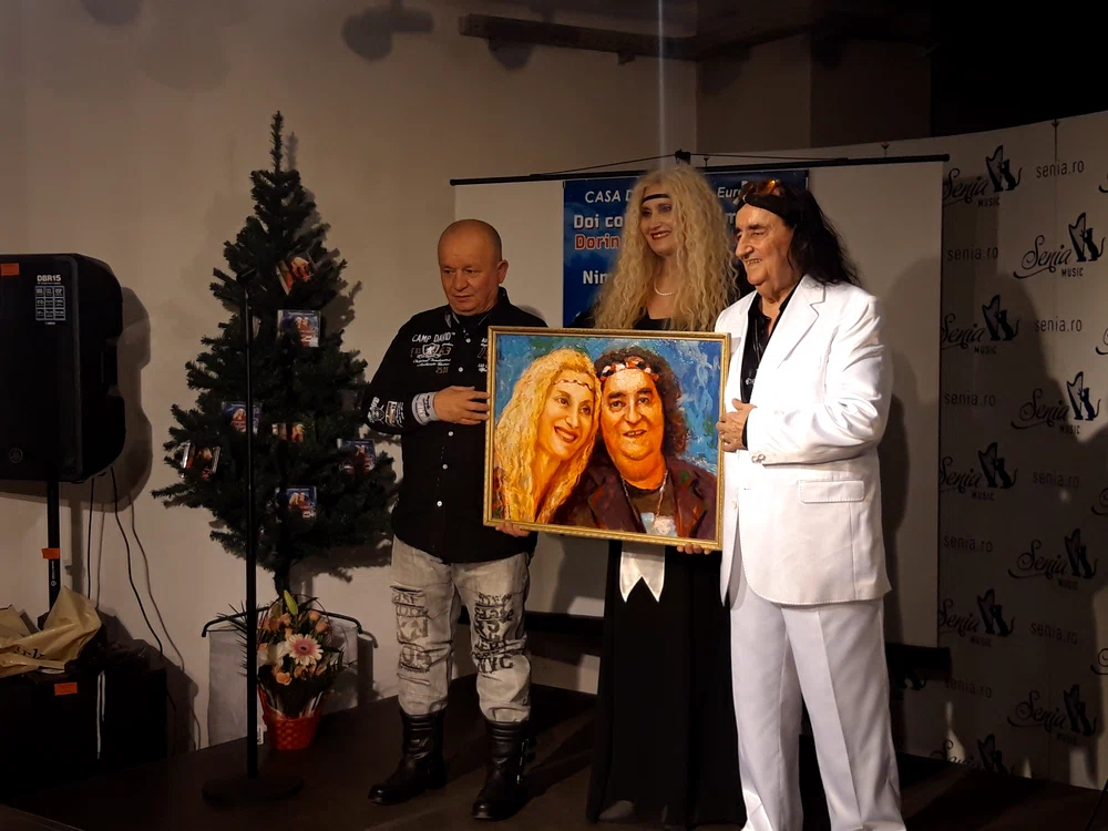 Marian Nistor și Dorina Paraschiv au primit un tablou de la pictorul vedetelor
