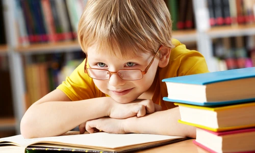 little boy smiling library jpg