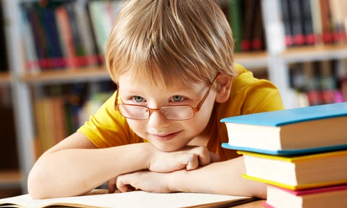 little boy smiling library jpg