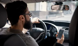 man using mobile phone while driving jpg