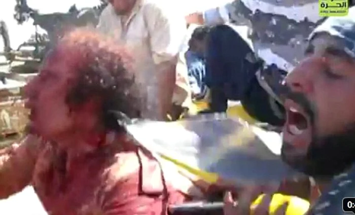 Gaddafi şi-a implorat călăii să-l cruţe