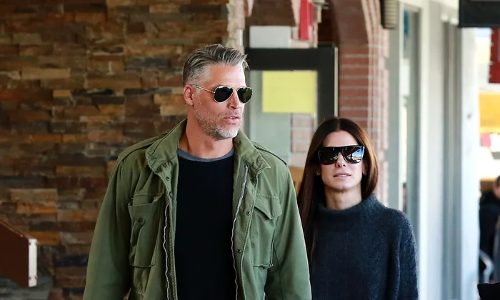 Exclusive    Premium: Sandra Bullock & Bryan Randall Out Shopping In Wyoming ***NO USE W/O PRIOR AGREEMENT   CALL FOR PRICING*** jpeg