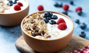 yogurt with berries muesli breakfast bowl blue background jpg