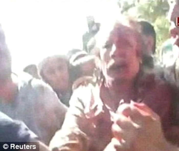 Gaddafi şi-a implorat călăii să-l cruţe