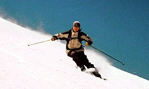 300px skier carving a turn jpeg