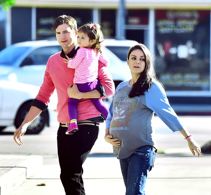 A very pregnant Mila Kunis along with husband Ashton Kutcher head to breakfast with daughter Wyatt in Studio City, CA jpeg