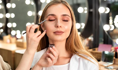 make up artist applying eyeshadow woman jpg
