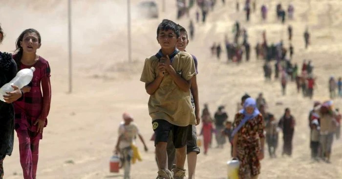 Refugiaţi din minoritatea yazidi. FOTO: Reuters