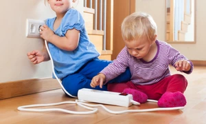 children playing with electrical extension outlet jpg