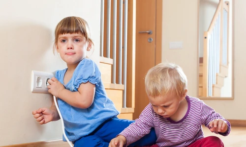 children playing with electrical extension outlet jpg