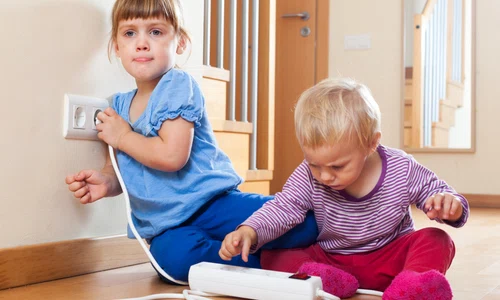children playing with electrical extension outlet jpg
