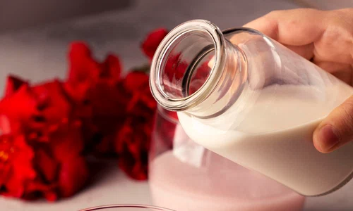close up hand holding bottle jpg
