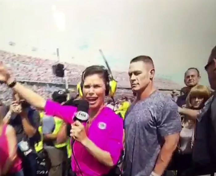 
    John Cena (38 de ani) și jurnalista Jamie Little, reporteră pentru postul de televiziune american Foxfoto: captură video  