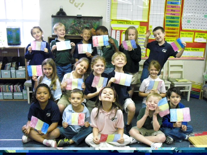 Copiii și steagurile românești