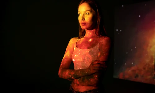 young woman standing universe texture projection jpg
