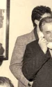 Ion Iliescu, în centru, vorbind la telefon. În stânga sa, Petre Roman. În dreapta lui, Adrian Sârbu