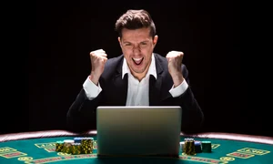 click ro man playing casino laptop 1 jpeg