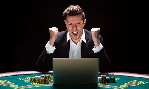click ro man playing casino laptop 1 jpeg