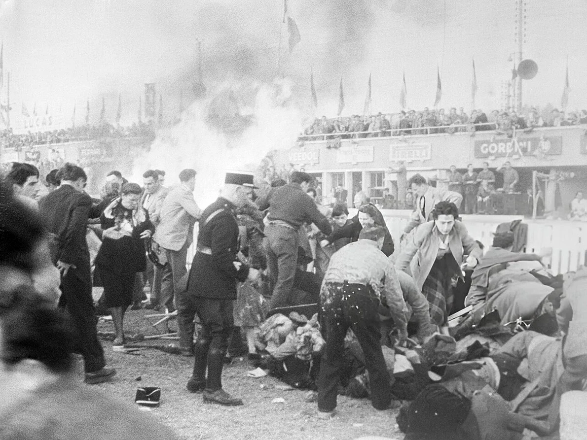 1955 Le Mans disaster Policemen Looking for Survivors UPI jpg