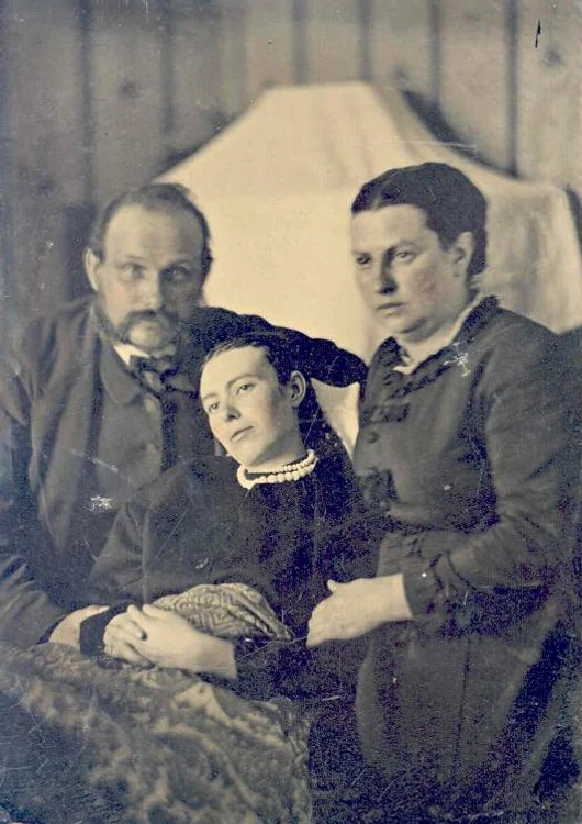 victorian era post mortem family portrait of parents with their deceased daughter jpg jpeg