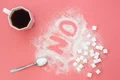 word no made sugar cup coffee pink background flat lay jpg