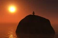 woman sitting rock sunset jpg