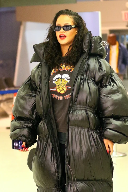 Rihanna arrives at JFK in oversized coat for a flight back to London jpeg