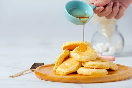 2 pancakes with maple syrup plate white background 1 jpg jpeg