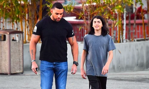 EXCLUSIVE: Michael Jackson's youngest son Blanket aka Bigi is almost as tall as his bodyguard while out in Encino, CA after dinner with sister Paris Jackson jpeg