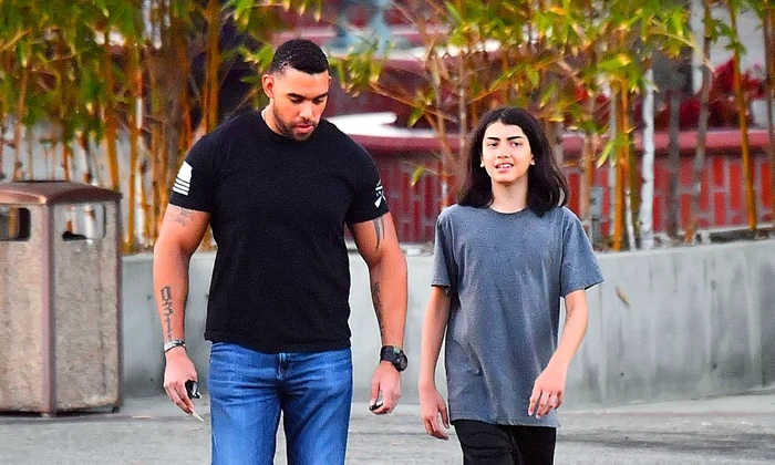 EXCLUSIVE: Michael Jackson's youngest son Blanket aka Bigi is almost as tall as his bodyguard while out in Encino, CA after dinner with sister Paris Jackson  jpeg